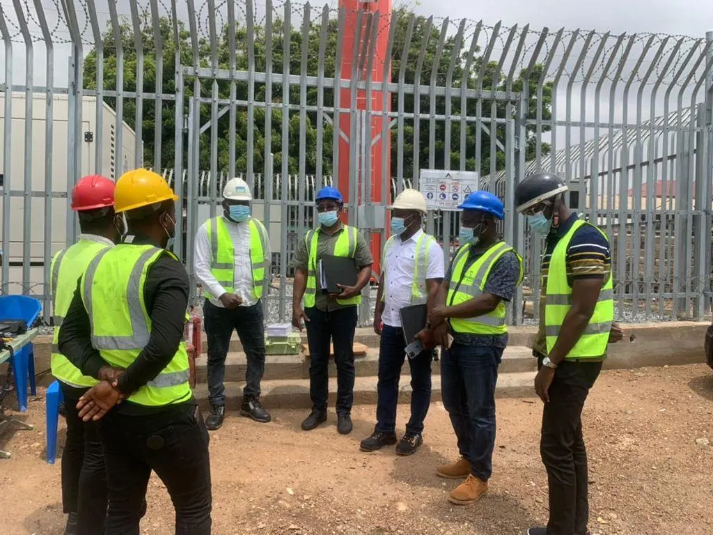 Opening site briefing with the full team in hi-vis and hard hats